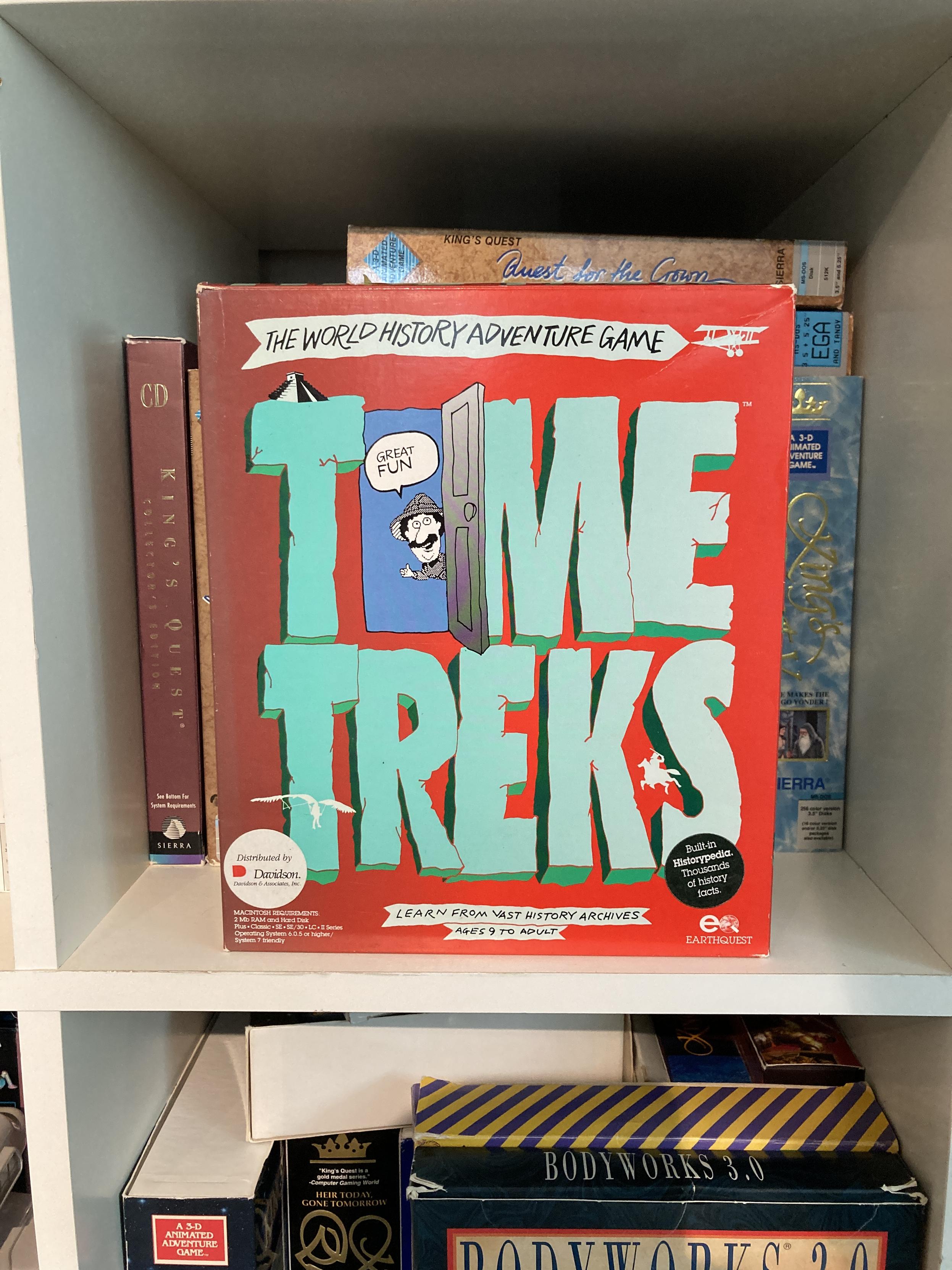 A copy of Davidson & Associates Time Treks: The World History Adventure Game. It shows a moustached character in a hat as a mascot.