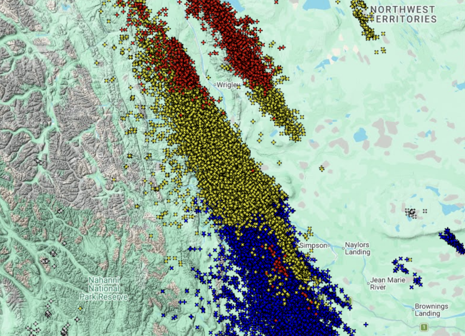 A satellite map of the western northwest territories. In the center of the map are thousands of points, each representing a single lightning strike. The red strikes are from the past 6 hours. The yellow strikes are from the past 12 hours. The blue strikes are from the past 24 hours.